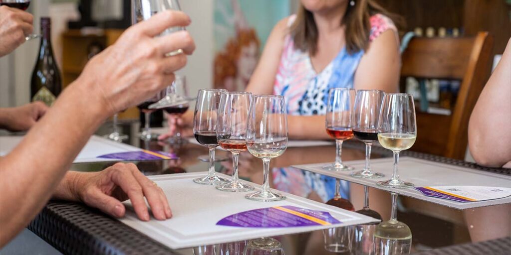 People sitting at a wine tasting